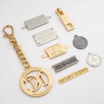 China Custom Metal Logo Tag For Handbag Luxury Gold Silver Letters Name Plate Clothing Label for sale