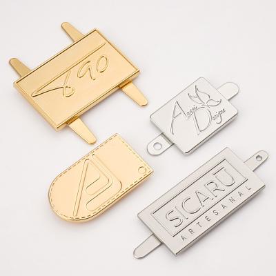 China Handbag Hardware Custom Metal Label Gold Metal Nameplate with Raised Engraved Logo for sale