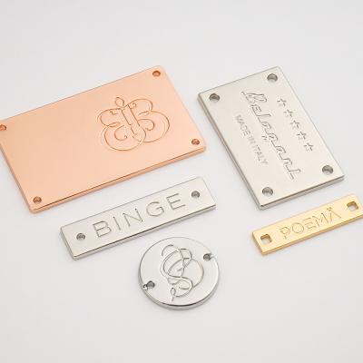 China Swimwear Customized Size Gold Sewing Metal Label Tag Silver Engraved Logo for sale