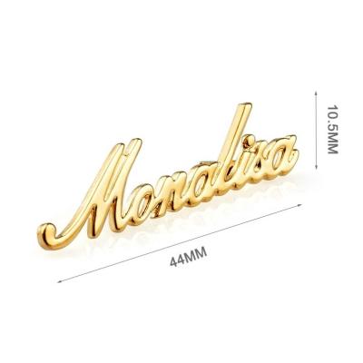 China Custom Gold Plated Metal Letter Logo Nameplate Perfect for Handbags Personalized Touch for sale