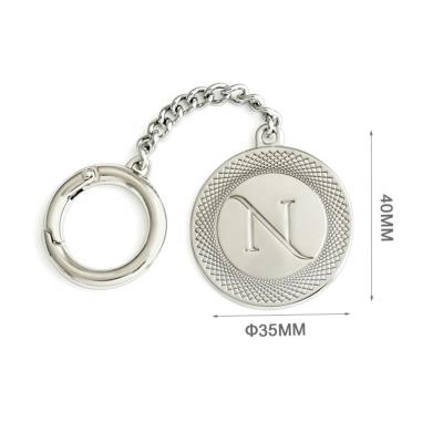 China Eco-friendly Handbag Accessories Custom Round Metal Logo Tag with Snap Hook and Chain for sale