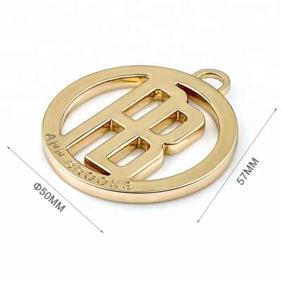 China Direct Custom Round Hang Metal Tag with Loop Zinc Alloy Fashion Design Badge Emblem for sale