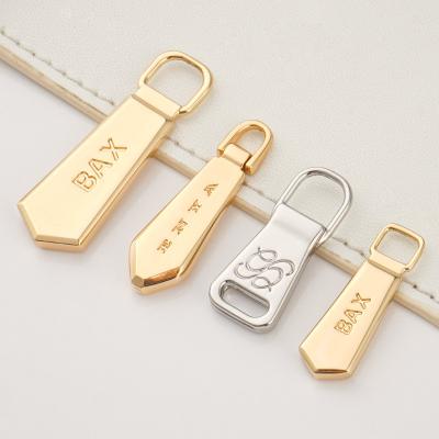 China Luggage Handbags Hardware Accessories Custom Zip Pullers Head 3 Gold Nickel Zipper Pulls for Bags for sale