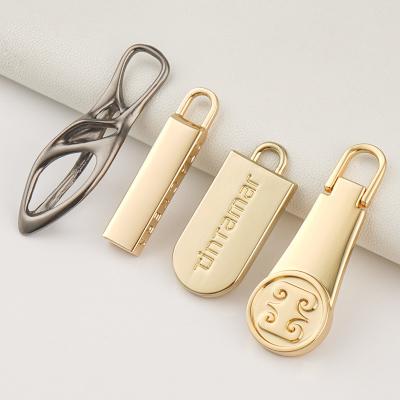 China Handbags Custom Zipper Puller 3 with Embossed Engraving Logo and Non Lock Slider for sale