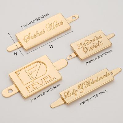 China Custom Metal Logo Tag for Handbag Design Metal Bag Labels Custom Gold Engraving Logo zu verkaufen