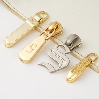 China Custom Zipper Pulls For Bags Fashion Design Gold Bag Zipper Puller 3 5 Silver Zip Puller for sale