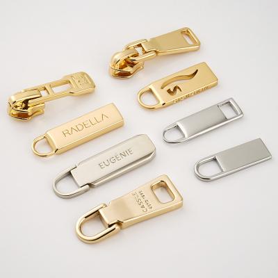 China Gold Plated Metal Zipper Pull Slider Type Non Lock Customized For Bags 3 Engraving Logo for sale