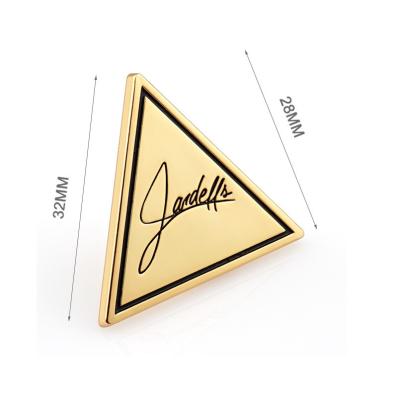 China Handbag Hardware Custom Triangle Shape Metal Label Plate Diecast Process Golden Plated for sale