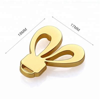 China Customized Fashion Bunny Ears Shape Design Gold Metal Logo for Small Purse and Wallet for sale