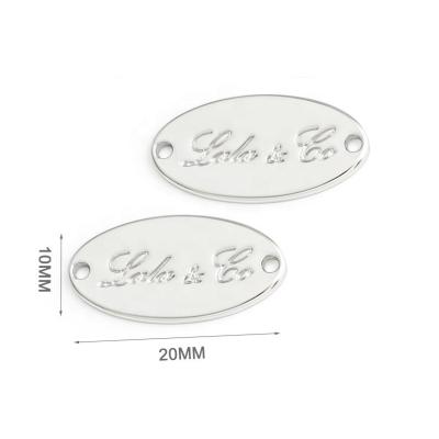 China Custom Metal Sewing Logo Tag Plate Labels Embossed for Garment Accessories Main Labels for sale