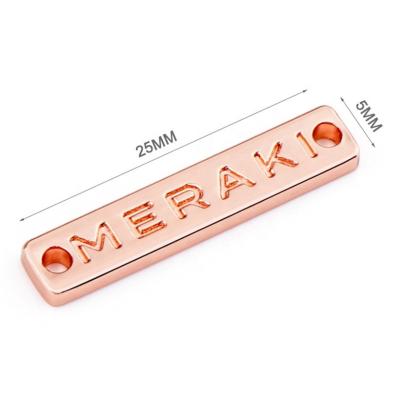 China Garment Accessories Customized Metal Clothing Labels Rose Gold Name Tags for Swimwear for sale