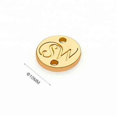 China Custom Metal Clothing Label Tags for Swimwear Metal Round Sewing Logo Golden Finish for sale