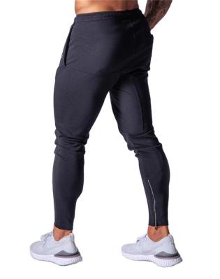 China Breathable Comfortable Tight Pants Custom Logo Printing Track Pants Fitted Gym Sports Casual Mens Track Pants for sale