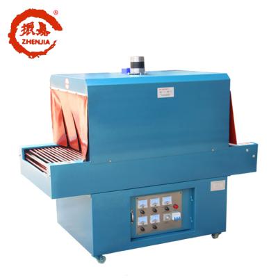 China Food PVC Film Beverage Shrink Packing Machine For PVC Film Shrink Paper Wrapping Packing Machine for sale