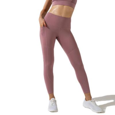 China Breathable Solid Color Plus Size Women's Pants And Trousers Outdoor Sports Fitness Yoga Pants With Pocket for sale