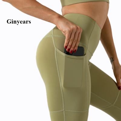 China Breathable Plus Size High Waisted Ladies Pants Sexy Butt Lift Yoga Pants With Pocket for sale