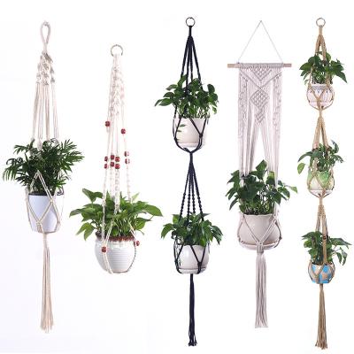 China Natural Plant Hanger Touch Planter Basket Decorative Hanging Cotton Rope Handmade Planters with Beads and Tassels for sale