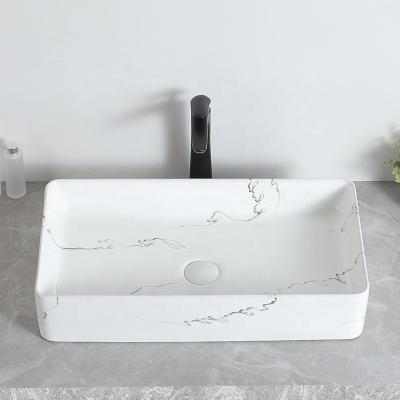 China Modern Unique Design Hot Selling Table Top Ceramic Sink Rack Washing Designs for sale