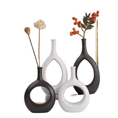 China Nordic Modern Europe White And Black Ceramic Vase For Home Office Cavity Decor Indoor Decorative Ceramic Flower Vase for sale