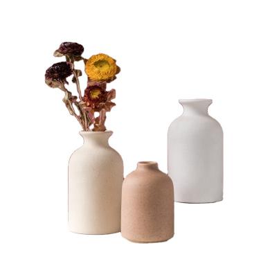 China Nordic Retro Rustic Decoration Clay Pottery Flower Vase Minimalistic White Small Bud Europe Boho Ceramic Vase For Shelf Home Decor for sale