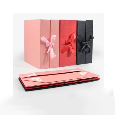 China Recyclable Luxury Cardboard Box Paper Pink Book Shaped Collapsible Packaging Folding Gift Box With Ribbon for sale