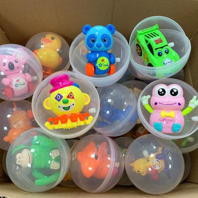 China Cartoon Toy 100mm Surprise Egg Capsule Toys Bulk Egg Vending Machine Plastic Capsule Toy for sale