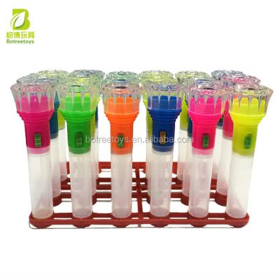 China Promotional Toys Flashlight Shape Tube Packaging Toys Candy Dispenser Toy With Pedestal for sale