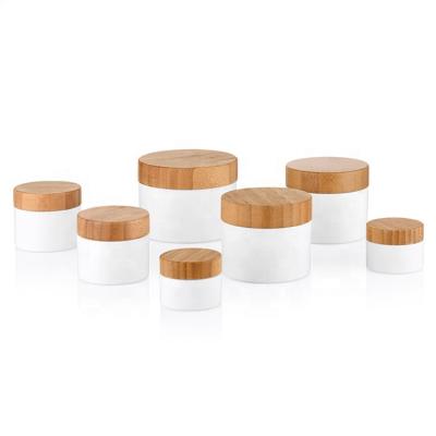 China 15G 20G 30G 50G 100G 150G 200G 250G Round Shape Cosmetic PP Wall Jars Elegant Empty Cream Container Jars With Bamboo Lid for sale