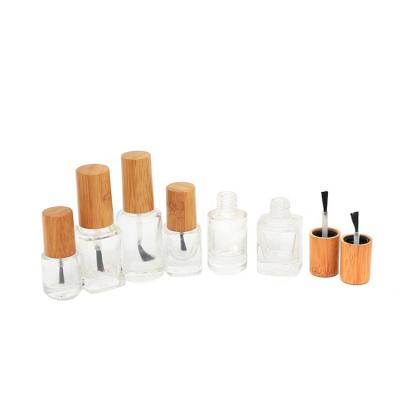 China Eco-friendly Personal Skin Care Packaging 5ml 8ml 10ml 12ml 15ml Round Shape Nail Polish Empty Glass Bottle With Bamboo Brush Cap for sale