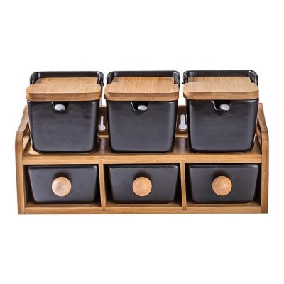 China Sustainable 6 Pcs Sets Hot Selling Fancy Ceramic Spice Jar With Wooden Spoon And Bamboo Tray Rack for sale