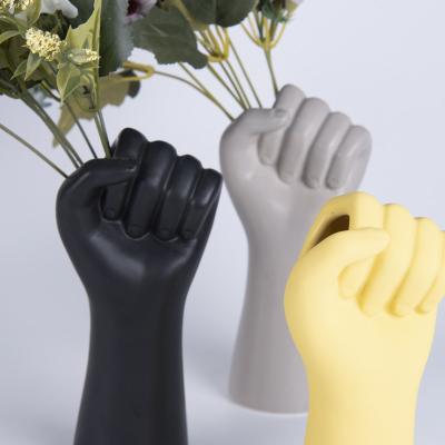 China Europe style modern decorative black yellowand gray hand shape custom flower vase for hotels restaurant home decoration for sale