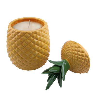 China Wholesale high quality uncommon home decoration yellow and orange green ceramic pineapple candle jar with lid for home decoration for sale