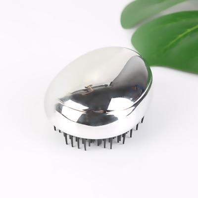 China Customized egg shape hair styling waterproof electroplating plastic massage new mini comb egg hair brush personalized detangling for sale