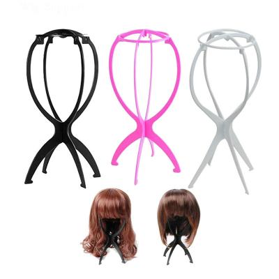 China Strongly Fixed Colorful Adjustable Plastic Portable Wig Display Stand Folding Wig Display Rack for sale