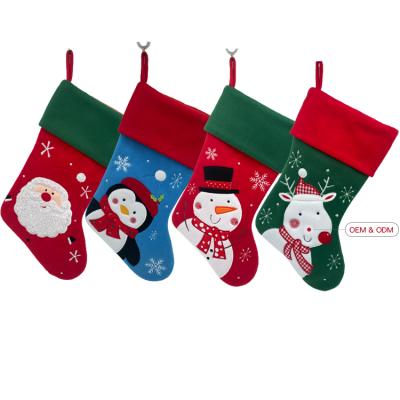 China Eco-Friendly Materials Wholesale Blue Festival Decoration Stockings Christmas Customized Santa Snowman Penguin Embroidery Christmas Stocking for sale