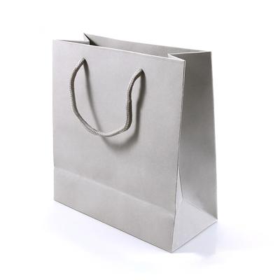 China Recyclable Wholesale Paper Gift Bags Luxury Custom Wedding Gift Bags With Ribbon for sale