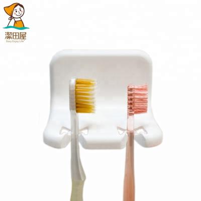 China Homeware Durable Movable Strong Plastic Toothbrush Holder With Magic Sticker Moving Purpose Easy To Clean And Install On The Wall for sale