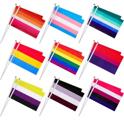 China Custom printed color stability lgbt hand flag parade peace 14x21cm polyester bar flying rainbow flag for sale