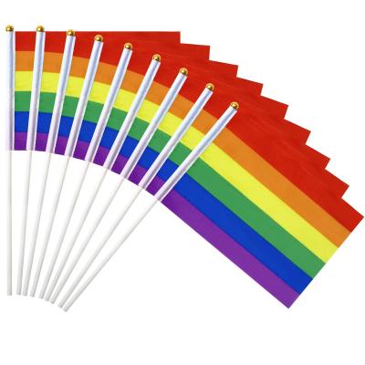 China Custom Printed Polyester Bar Flying Rainbow Flag Color Stability Rainbow Hand Flag Parade Peace 14x21cm for sale