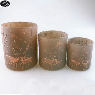 China Unique Hand Painted Embossed Decorative Embossed Amber Glass Candle Jars for sale