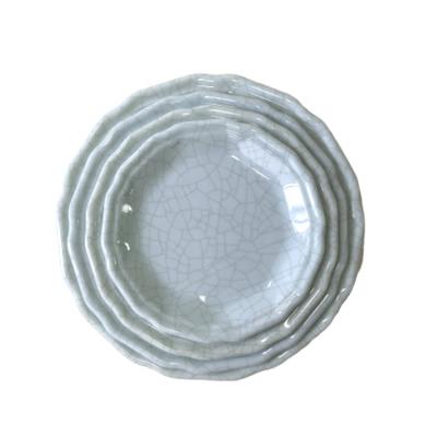 China Sustainable New Design Ice Slot Pattern With Wavy Lace Round Melamine Plate for sale