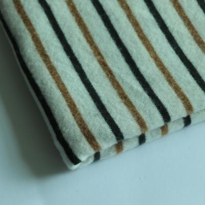 China Raw Side Brush Poly Fabric One Side Brush Dye Dye Stripe Needle Jersey Single Jersey Sweater Fabric for sale