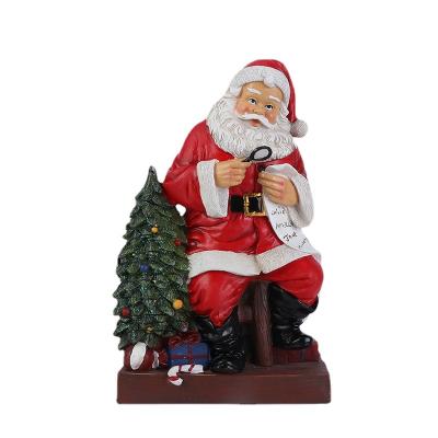 China Resin Christmas Decoration For Christmas Home Train Doll Santa Claus Glowing Christmas Gifts for sale