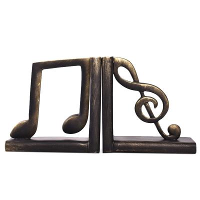 China Minimalist Creative Book Clip Decoration Handicraft Bookends Musical Notes Resin Resin Desktop Decor TV Cabinet Antique Cabinet Decoration for sale