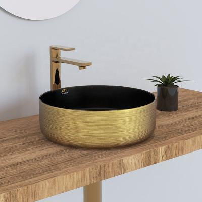 China Amazon Modern New Arrival Hot Sale Wash Basin Black Color And Gold Ceramic Sink With Gold Face for sale