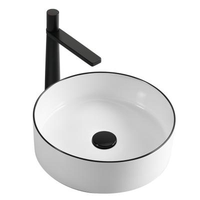 China Modern Round Shape Black Edge Color Slim Edge Ceramic Bathroom Table Art Basin For Hotel for sale