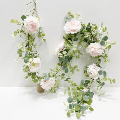 China Realistic Looking Artificial Flower Garland Eucalyptus Round Leaf Rose Peony Flower For Wedding Backdrop Arch Wall Decor for sale