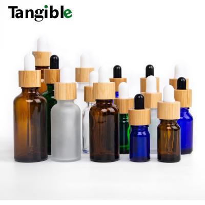 China Wooden Cosmetic Bamboo Glass Cap Essential Oil Glass Bottle Dropper Cap Tamper Proof and Cap for Oil Glass Bottle for sale