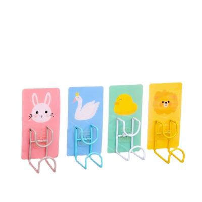 China Waterproof Wall Mounted Hole Free Hook New Arrival Creative Cartoon Seamless Hook Bathroom Shelf Hook Non Perforated Strong Adhesive Hook for sale