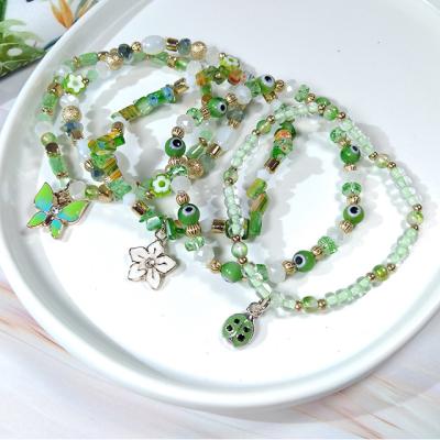 China Fashion TRENDY Jewelry Light Green Elastic Beads Bracelet Sets With Butterfly Charms Mixed Glass For Women And Girls for sale